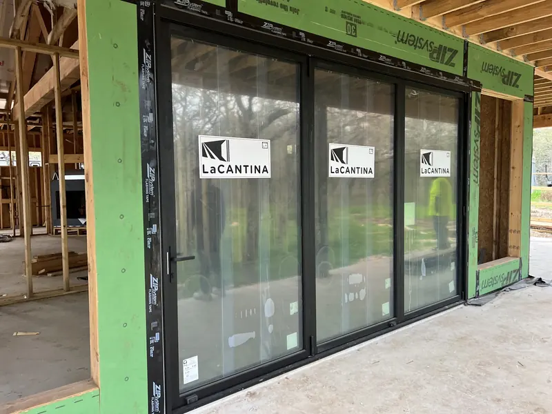 LaCantina folding glass doors installed across the rear wall of a new build