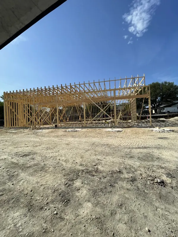 Long span commercial roof trusses set over a new retail building