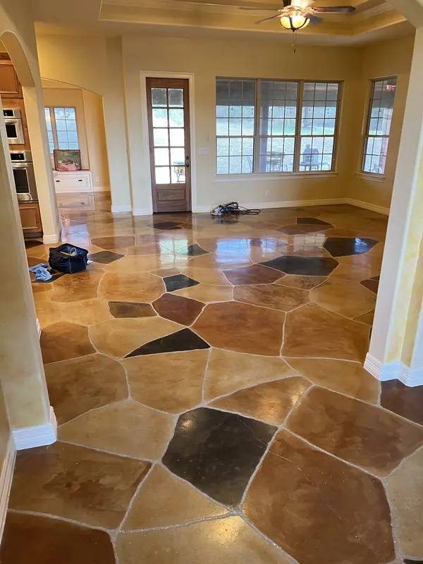 Stained and sealed decorative concrete flooring in a sunroom
